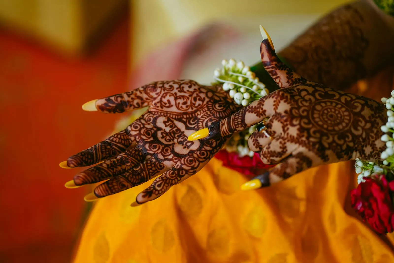 A bride's hands with intricate mehndi