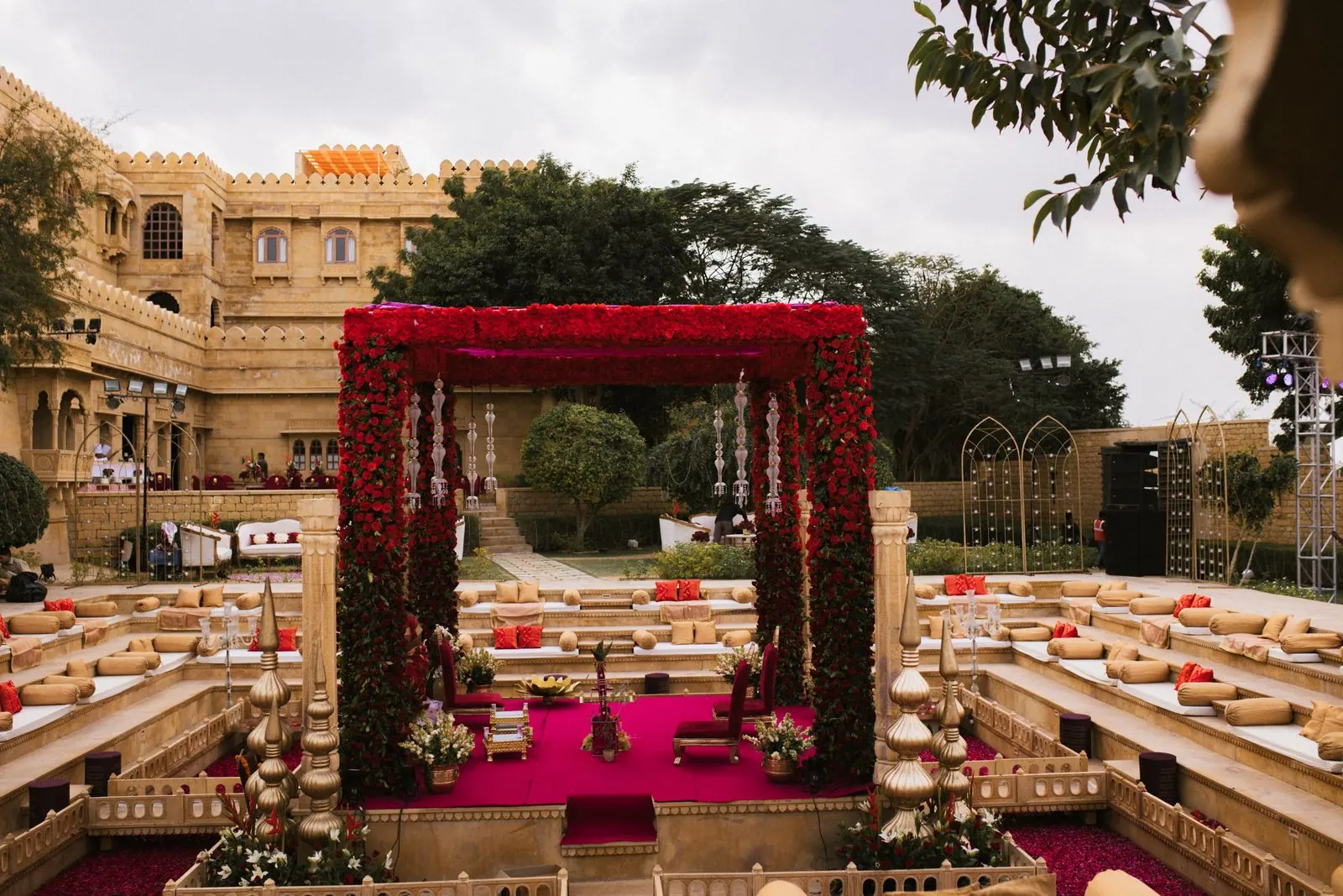 A flower-decked mandap in a palace courtyard
